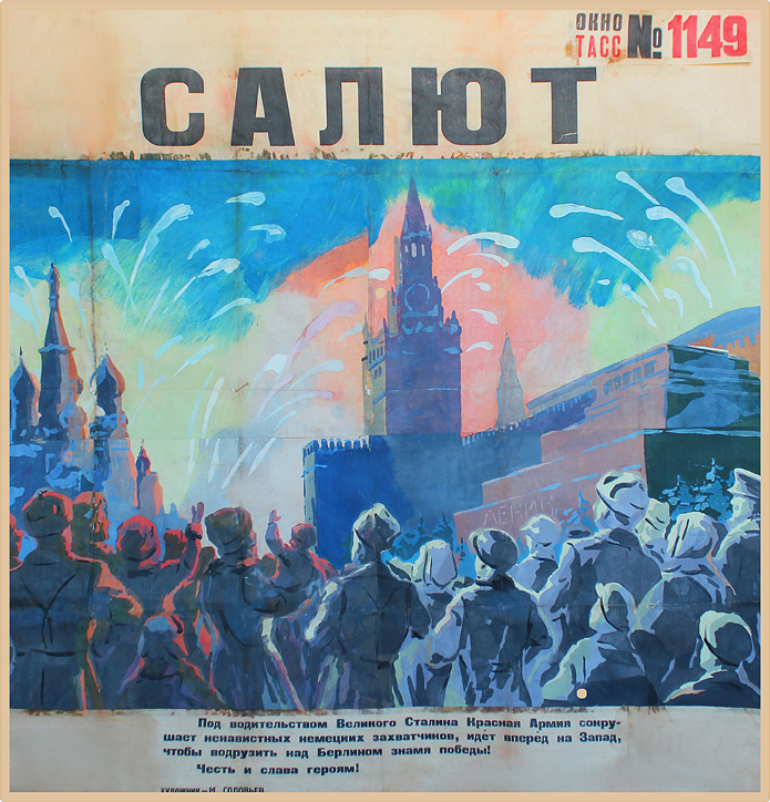 Crowd of people watch fireworks display; blue, pink, black